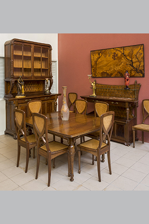 Louis MAJORELLE (1869-1926) - Mobilier de salle à manger modèle « Chicorées » en noyer et placage de palissandre